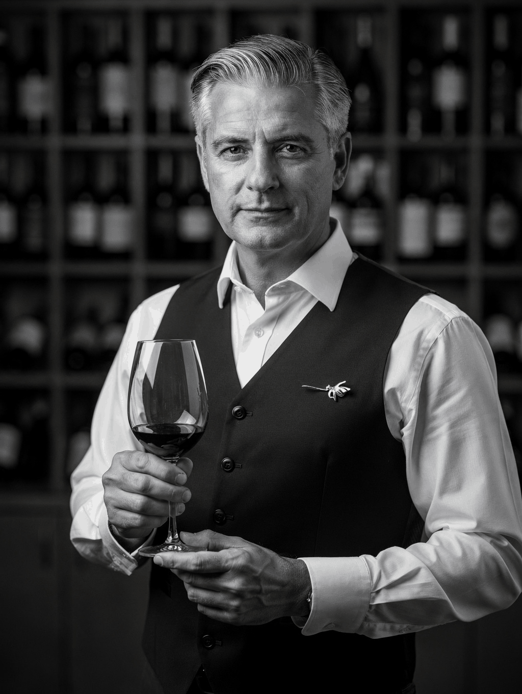 Head Sommelier Luca Ferrari pouring a glass of red wine